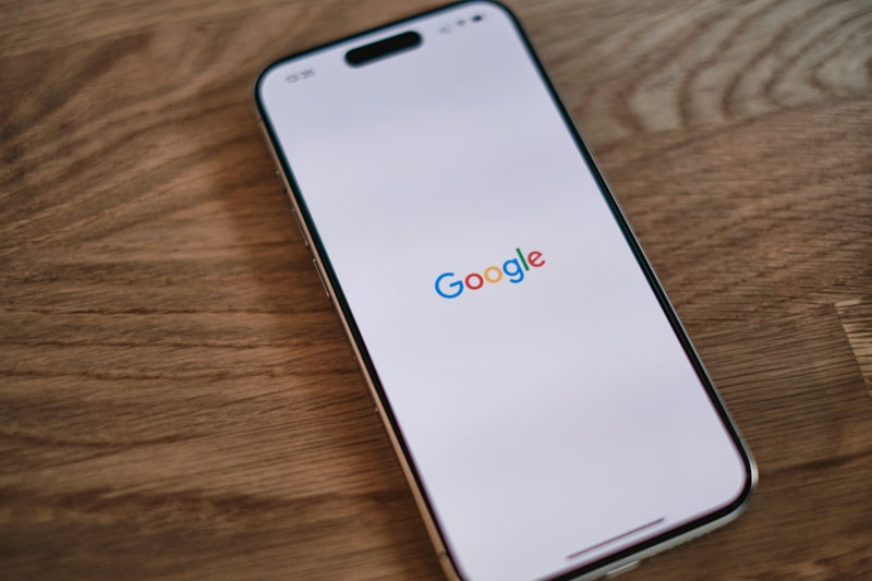 A close up of a cell phone on a table