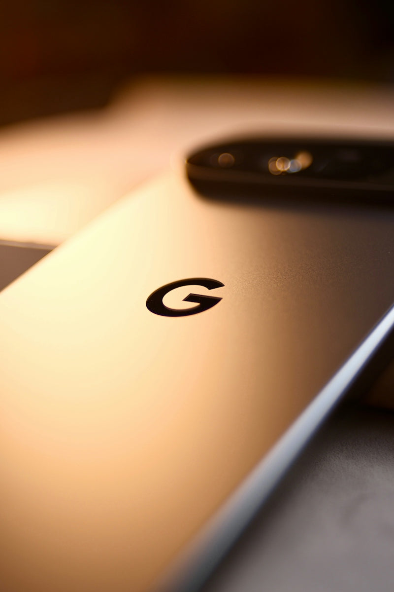 A silver smartphone with the google logo on its back